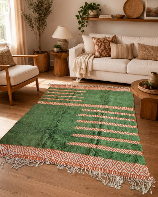 Green and terracotta Moroccan rug styled in a warm boho living room.