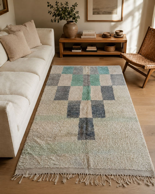 Vintage mint green and gray Moroccan rug styled in a relaxed living room.