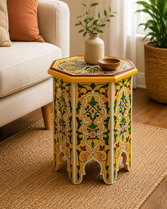 Vibrant yellow Moroccan accent table featuring traditional geometric hand-painted patterns and architectural cutout legs.