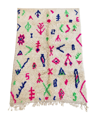 Handmade ivory Moroccan wool rug with colorful pink, blue, and green abstract motifs.