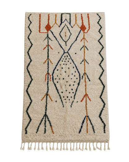 Full overview of the rectangular handmade Moroccan wool rug displaying its ivory background and abstract geometric patterns 