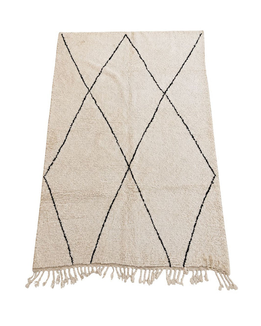 Ivory handmade Moroccan wool rug with thin black diamond lines and tassel fringe. 