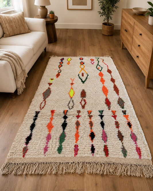 Multicolor Moroccan rug styled in a warm boho living room. 