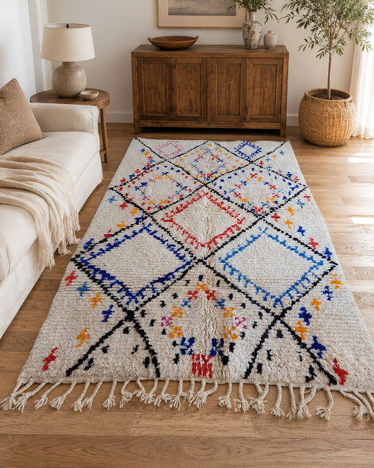 Colorful Moroccan geometric rug styled in a warm boho living room. 