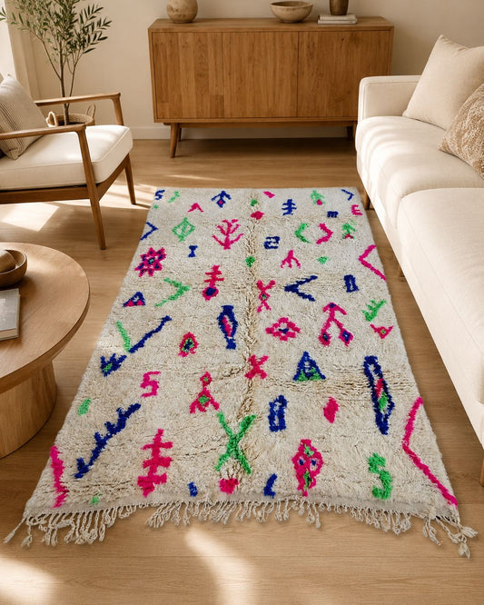 Colorful Moroccan wool rug displayed in a warm boho living room. 