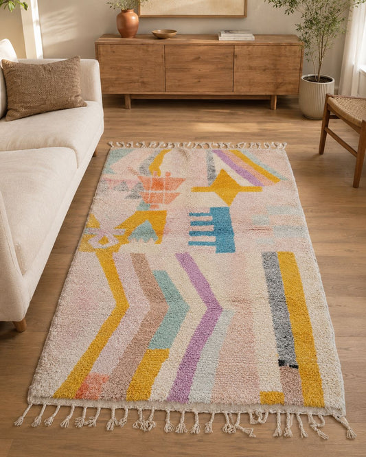 Pastel abstract Moroccan rug styled in a warm contemporary living room. 