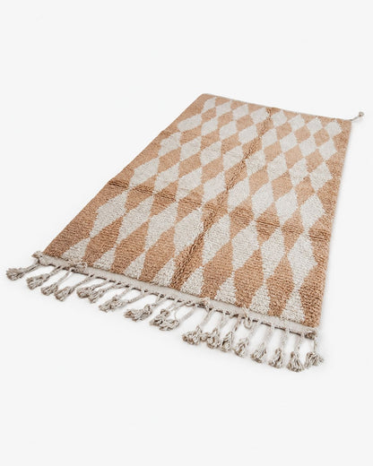 Front view of a beige wool rug with elongated ivory geometric diamonds. 
