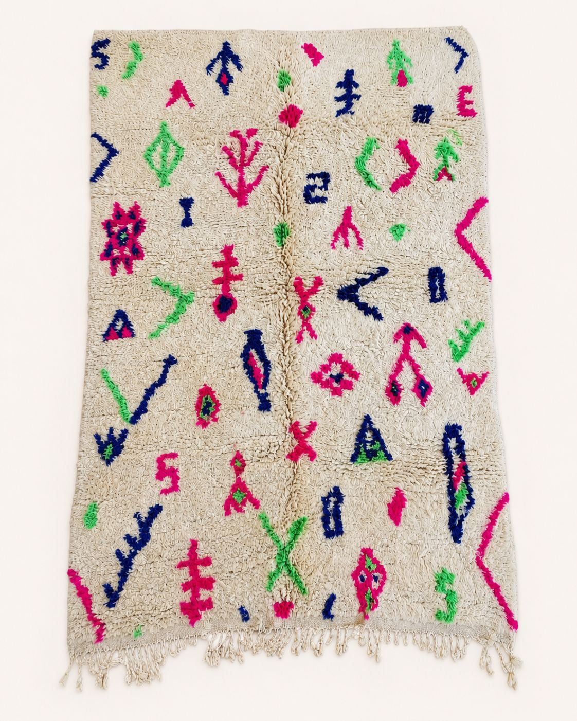 Flat view of an ivory wool rug with scattered colorful geometric symbols. 
