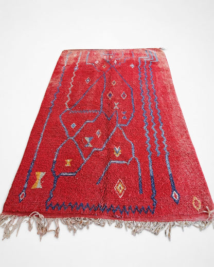 Back view showing the rug’s handmade construction and finished edges. 