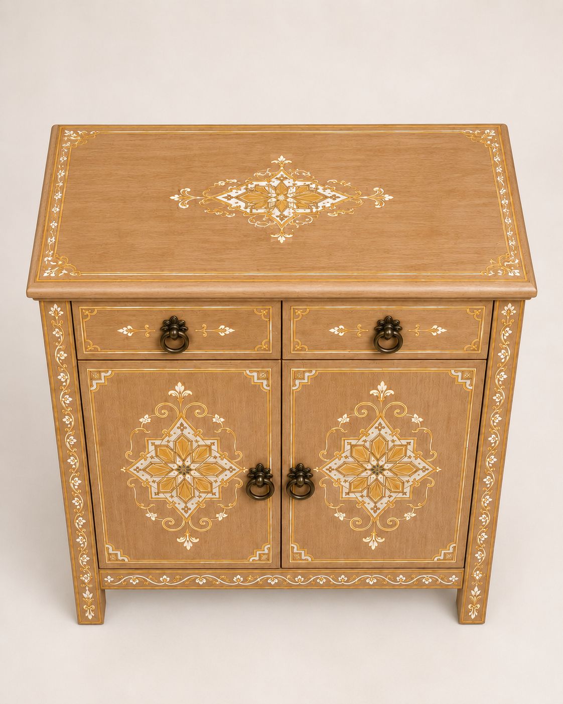 Close-up of hand-painted geometric motifs on a wooden cabinet