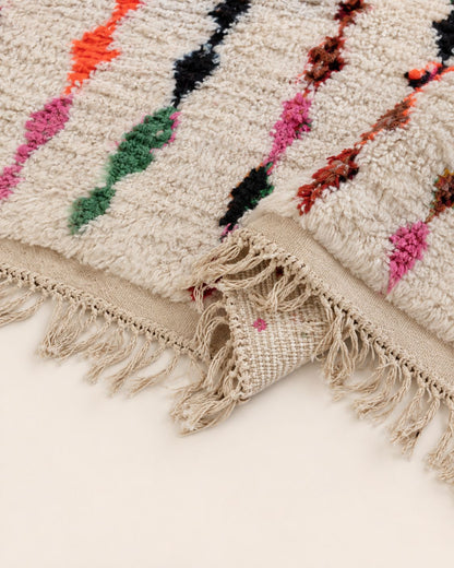 Back view showing the handmade rug’s woven construction and finished edges. 