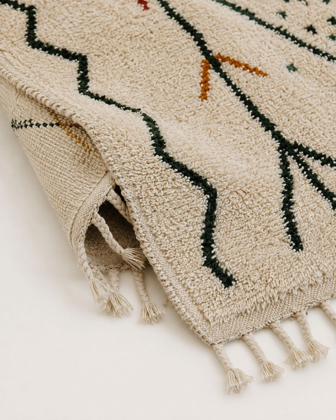 A view of the underside of the rug showcasing the authentic hand-knotted weave structure.