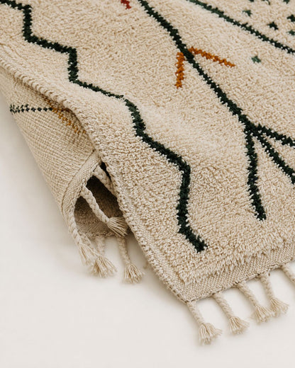 A view of the underside of the rug showcasing the authentic hand-knotted weave structure.