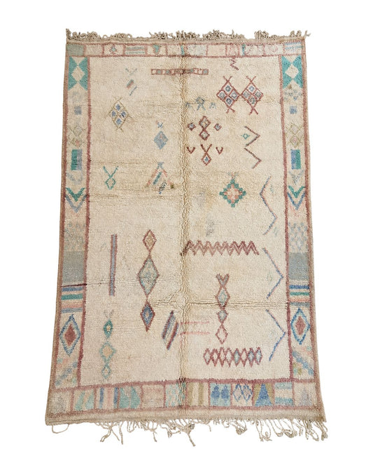 Vintage ivory Moroccan rug with faded pastel geometric motifs and tassel fringe. 
