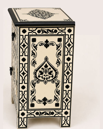 Side view of artisan Moroccan painted wooden storage cabinet 