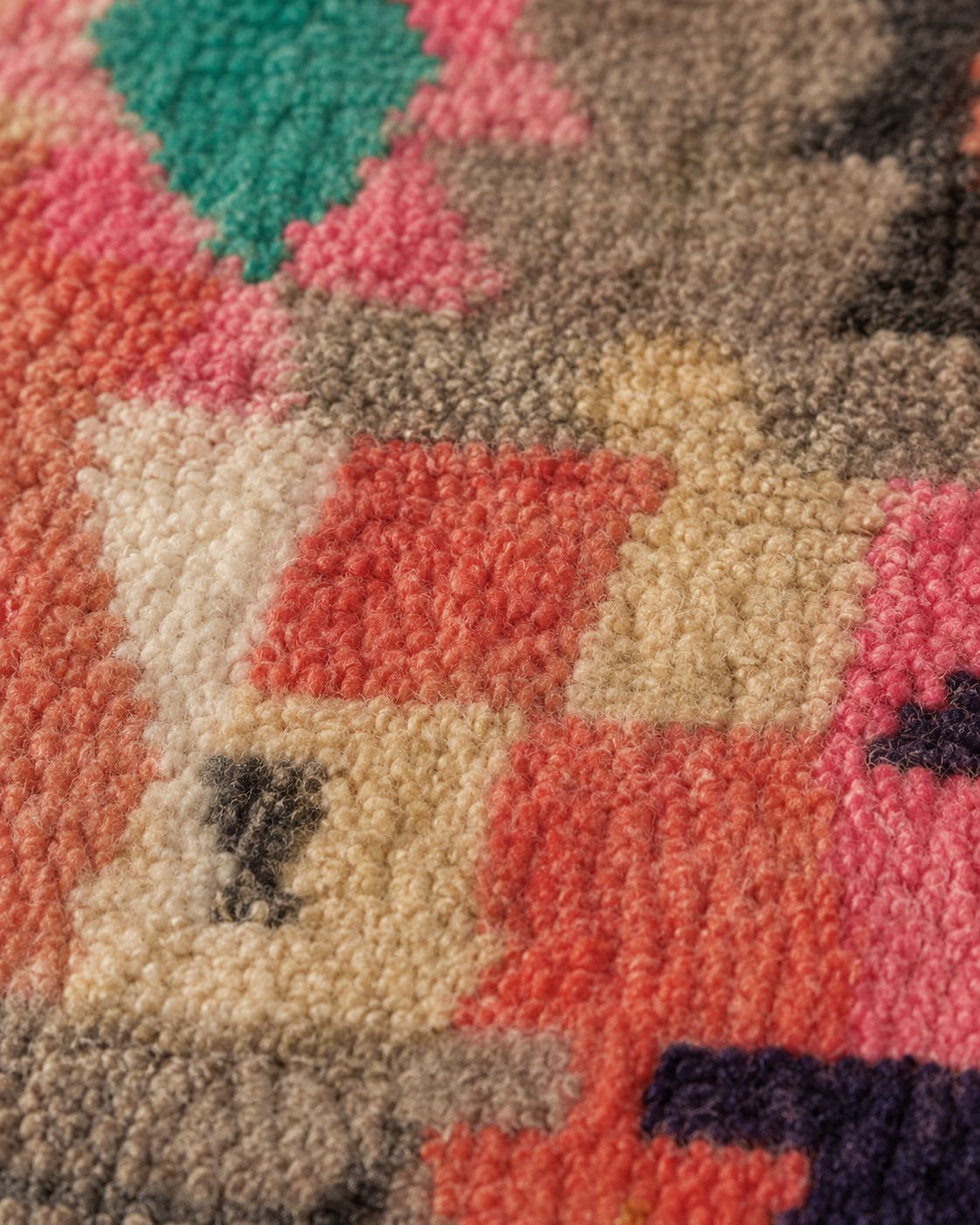 Front view of a colorful abstract Moroccan wool area rug. 