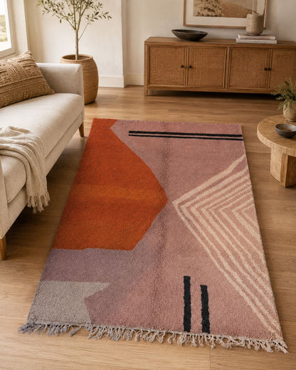 Modern living room featuring a blush pink handmade Moroccan wool rug. 