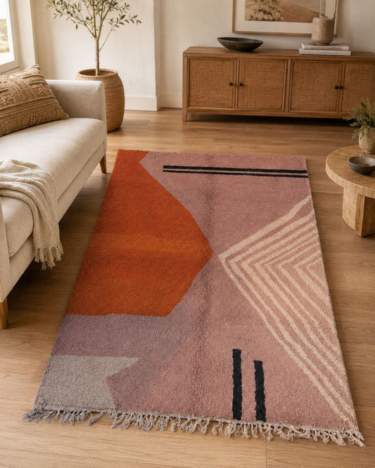 Modern living room featuring a blush pink handmade Moroccan wool rug. 