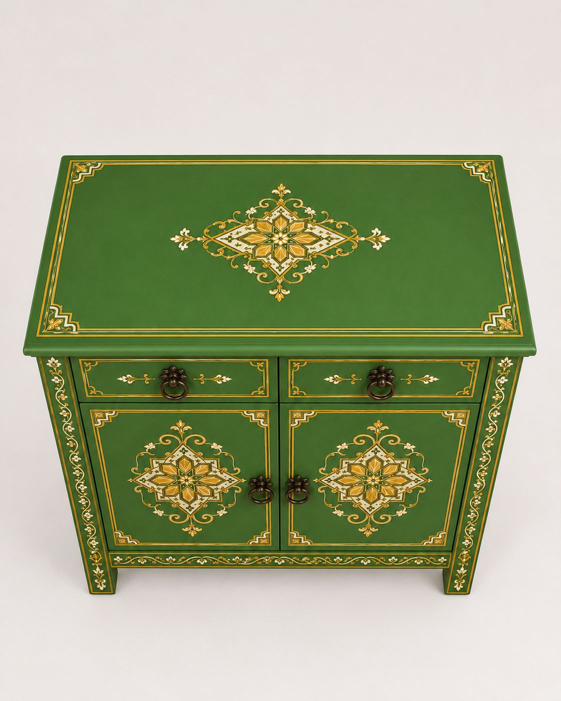 Close-up of gold hand-painted details on a green Moroccan cabinet