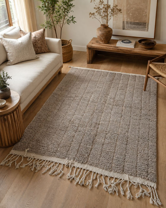 Handmade light taupe Moroccan rug styled in a neutral living room. 