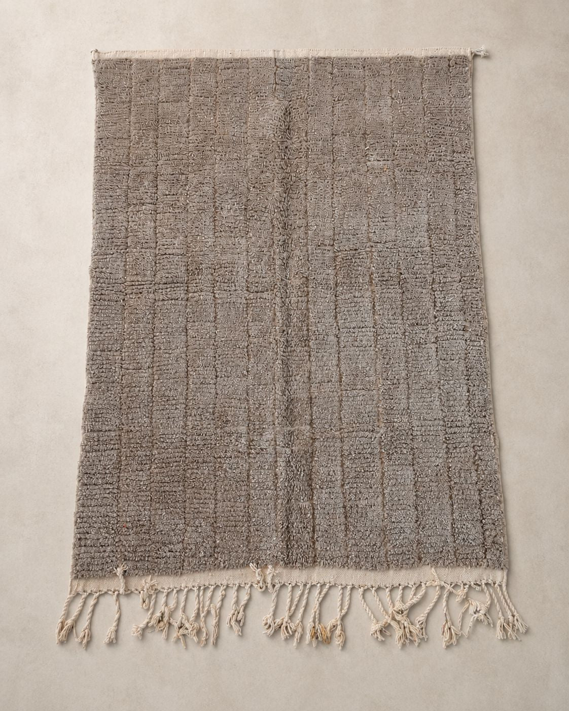 Front view of a minimalist Moroccan wool area rug. 