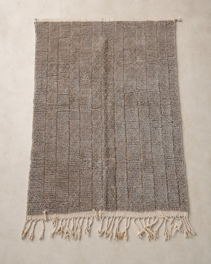 Front view of a minimalist Moroccan wool area rug. 