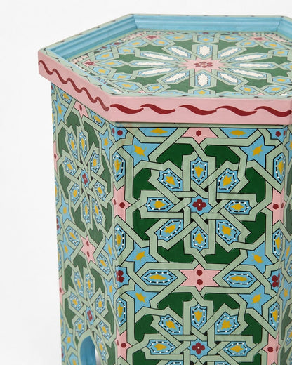 Moroccan hexagonal side table styled beside a cream sofa 