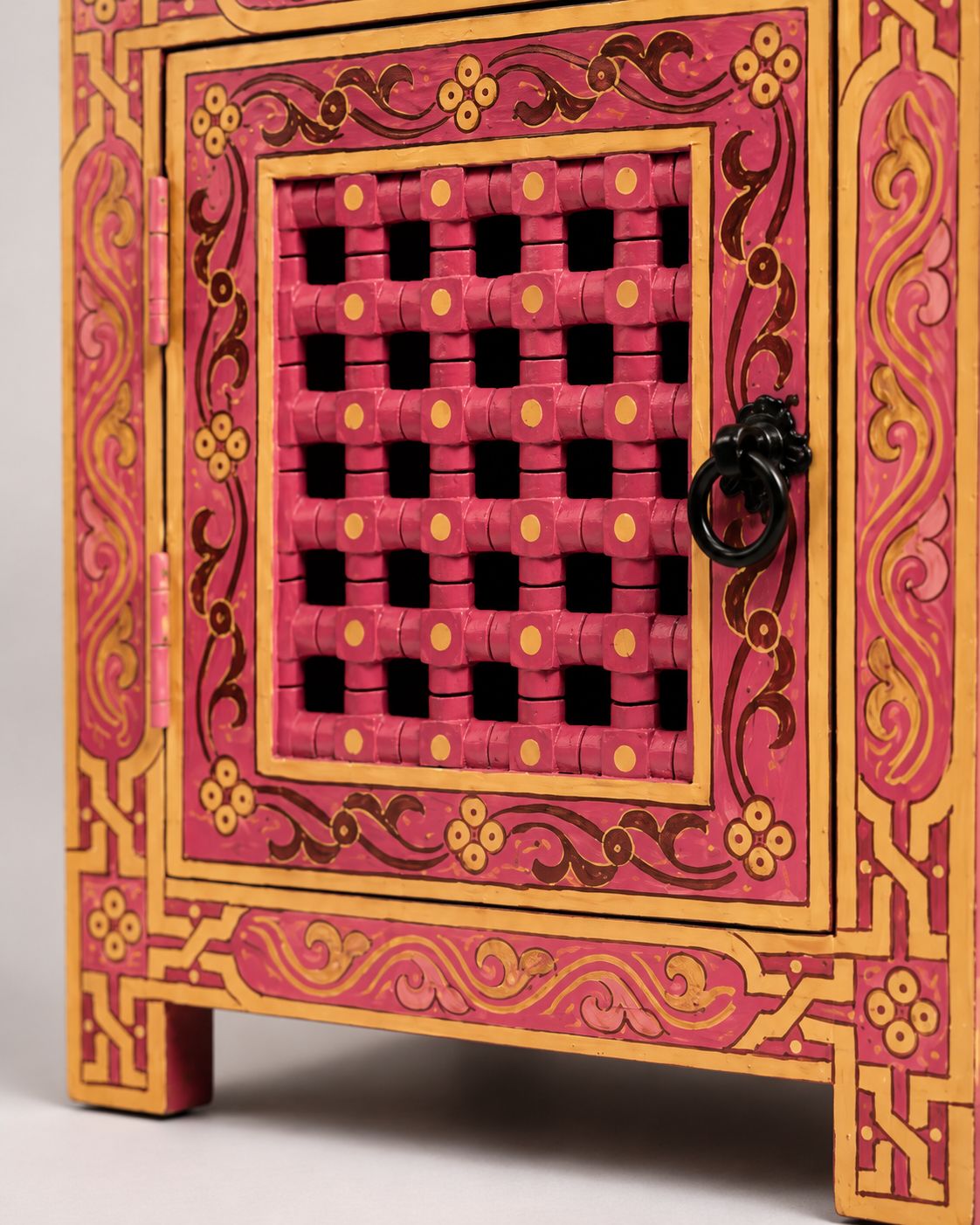 Decorative pink and gold box with intricate patterns