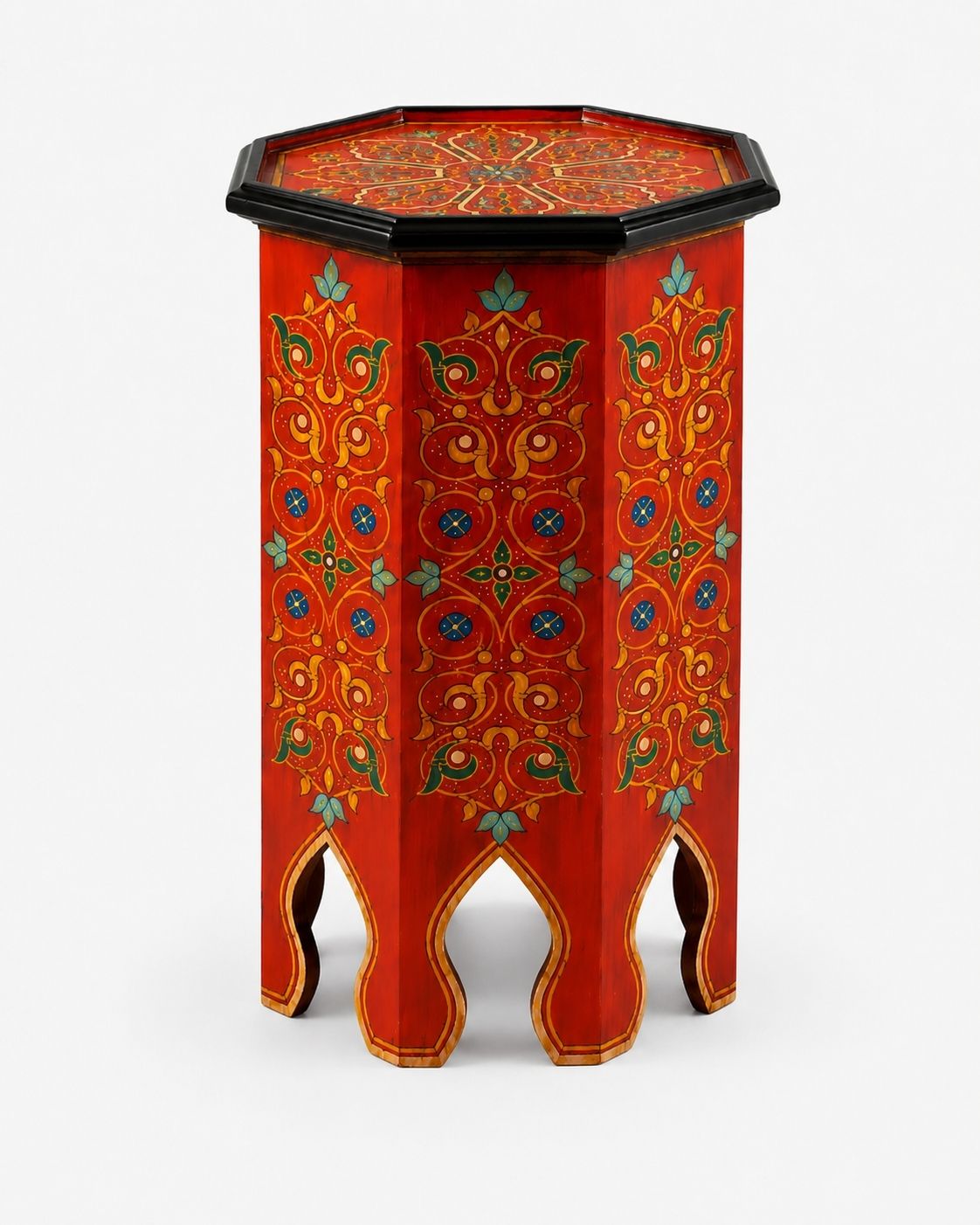 Red Moroccan accent table styled in a warm boho living room 
