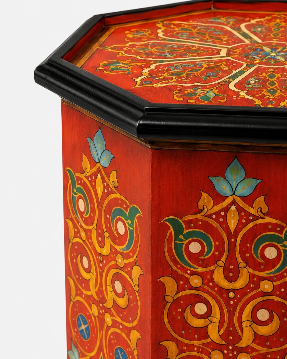 Close-up of hand-painted arabesque details on Moroccan table 