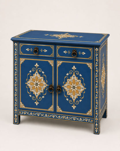 Royal-blue Moroccan storage cabinet styled beside a neutral bedroom bed