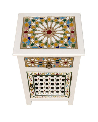 Side view of white Moroccan nightstand with colorful painted pattern 