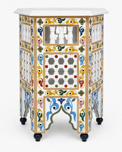 A highly decorative, hand-painted wooden cabinet with a white marble top and black feet, featuring intricate geometric and floral patterns in multiple colors.
