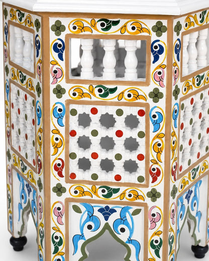 Colorful hand-painted wooden table with Moorish arch details 